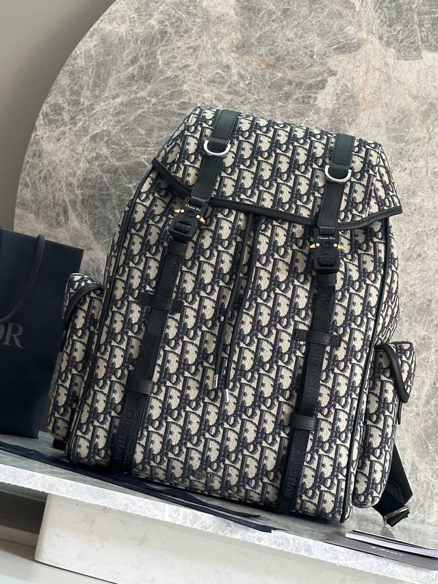 This Dior Hit The Road Flap Backpack Seamlessly Blends Modern Style With Dior's This Dior Hit The Road Flap Backpack Seamlessly Blends Modern Style With Dior's