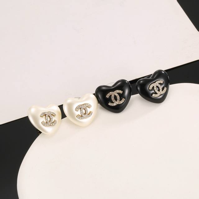 Chanel heart-shaped earrings, more flattering face shape. Surrounded by gold me