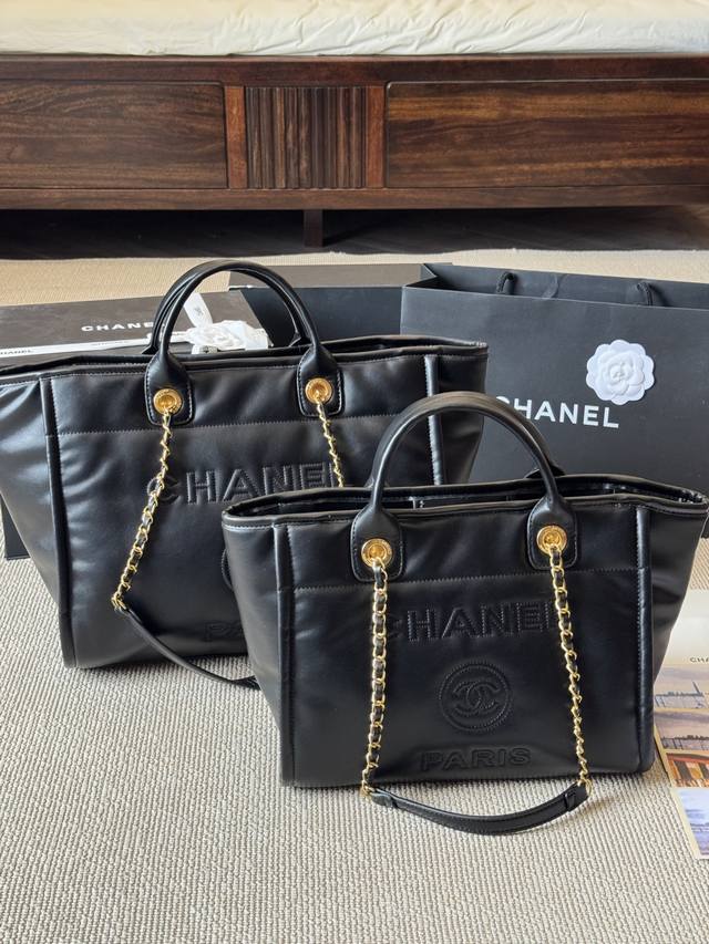 Top-grain cowhide Chanel 23P tote beach bag is large enough to be used as a trav