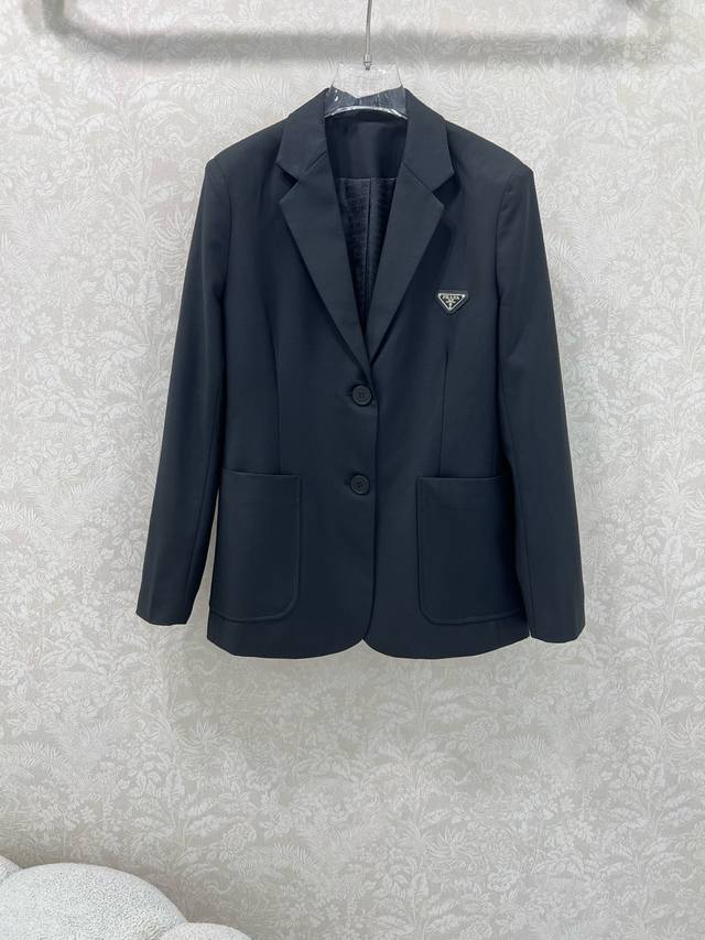 Prad*25 new blazer. The fabric is incredibly stiff and textured. The lining is a Prad*25 new blazer. The fabric is incredibly stiff and textured. The lining is a