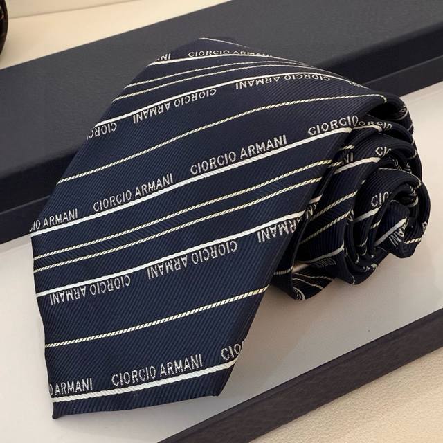 Armani Men's Tie This Emporio Armani tie features a classic arrow-shaped cut, m