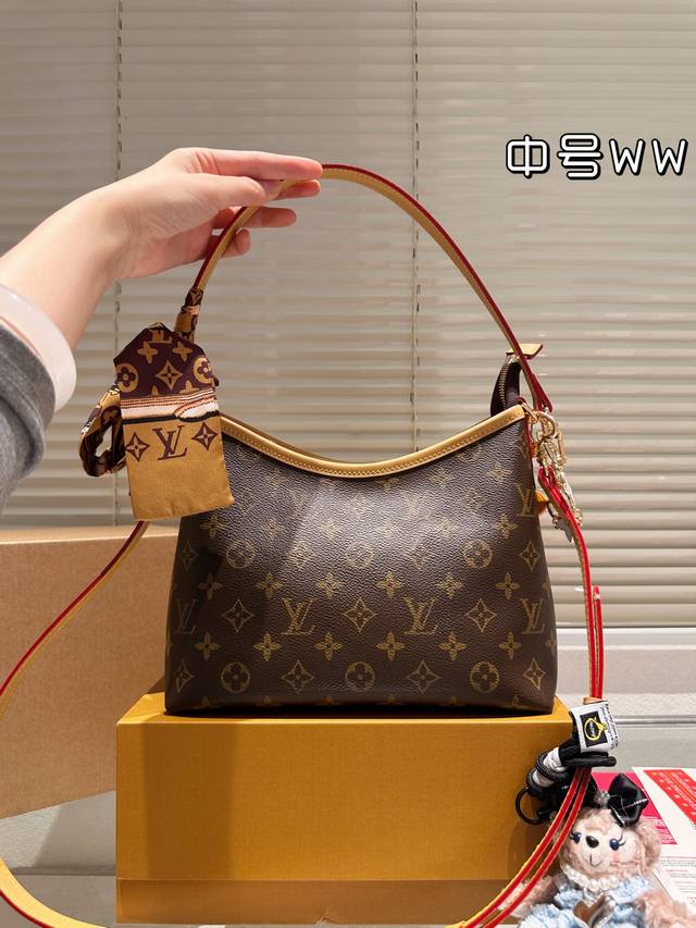 Medium-sized Louis Vuitton Hobo Bag (leather version), a classic moon bag, sligh