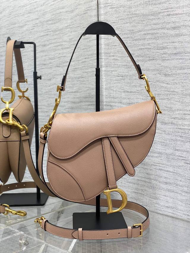 This large, dusty rose pink saddle bag with a long shoulder strap is the king o This large, dusty rose pink saddle bag with a long shoulder strap is the king o