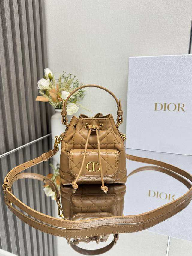 Authentic, High-Quality This mini Dior Caro bucket bag is a new addition to the