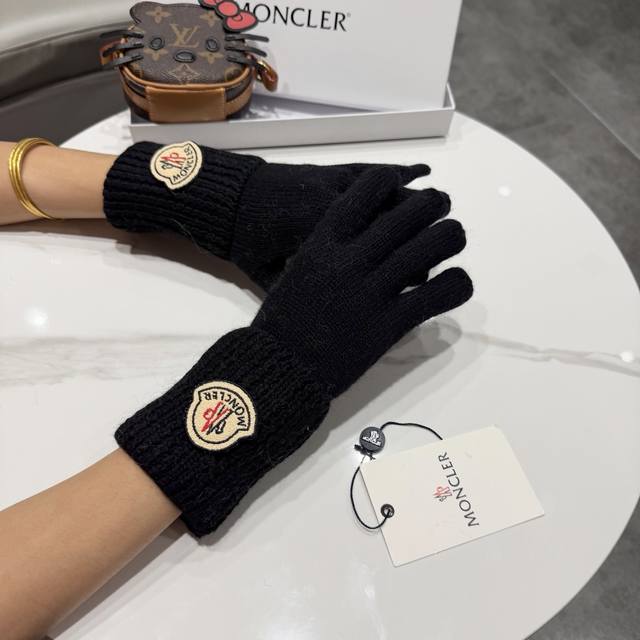 Moncler knitted gloves, available in four colors: black, white, beige, and gray