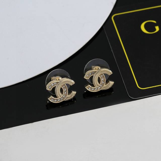 Chanel small gold stud earrings. These are versatile and stylish, easy to match
