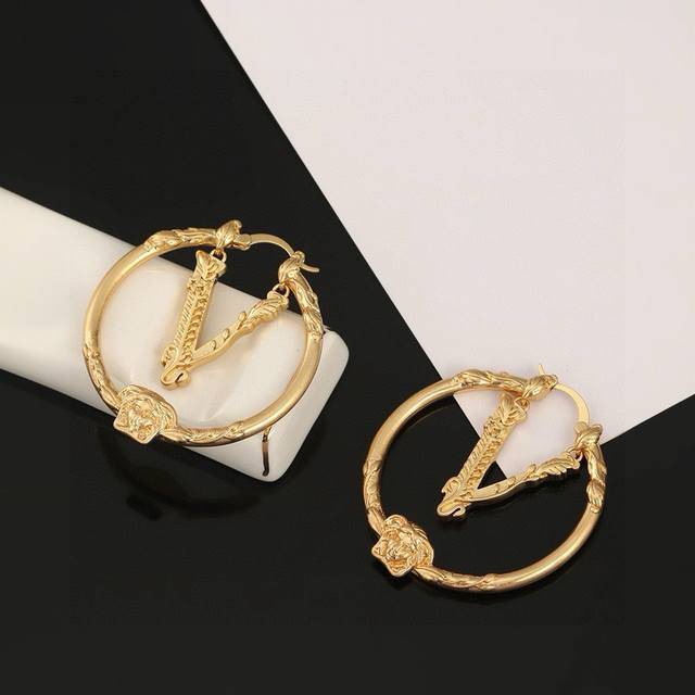 Versace Medusa face relief floral vine pattern large hoop earrings with a dynami