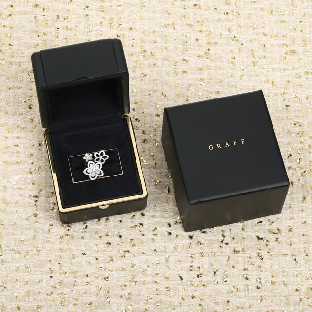 We offer the Graff Three Flowers ring, custom-made in 18K gold and with genuine