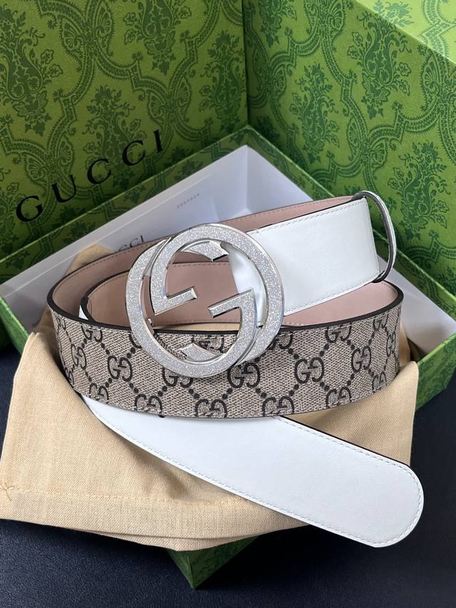 Features the brand's iconic double-G monogram pattern in a beige-ebony color co Features the brand's iconic double-G monogram pattern in a beige-ebony color co