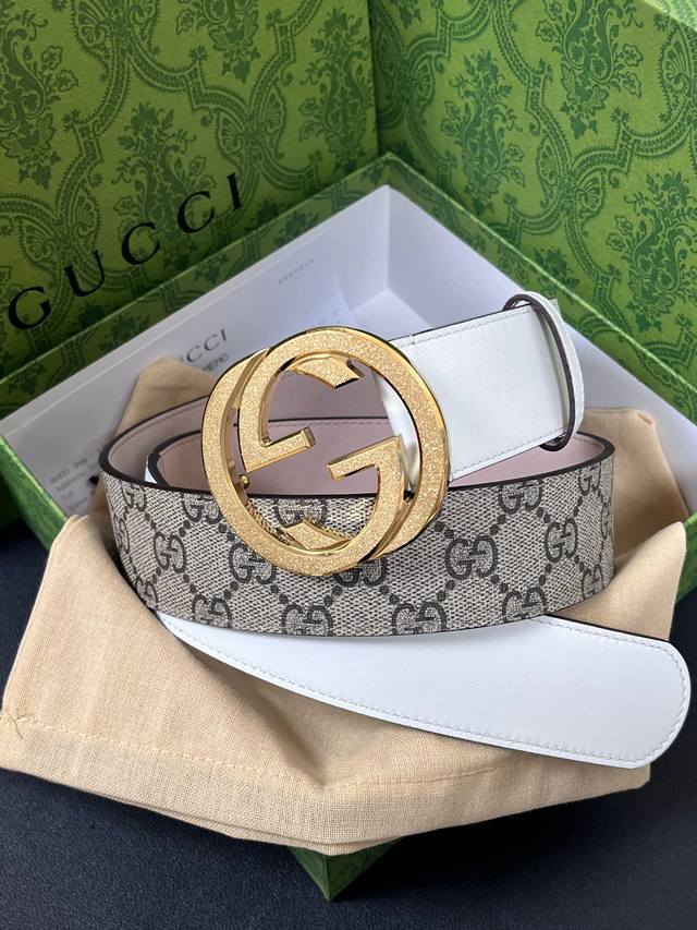 Features the brand's iconic double-G monogram pattern in a beige-ebony color co Features the brand's iconic double-G monogram pattern in a beige-ebony color co