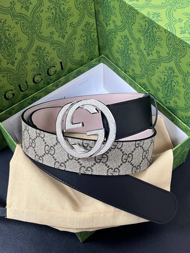 Features the brand's iconic double-G monogram pattern in a beige-ebony color co Features the brand's iconic double-G monogram pattern in a beige-ebony color co