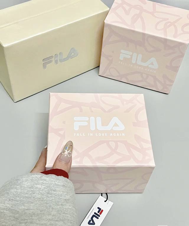 Fila! If you ask me, it has to be Fila! The small round watch has a touch of und
