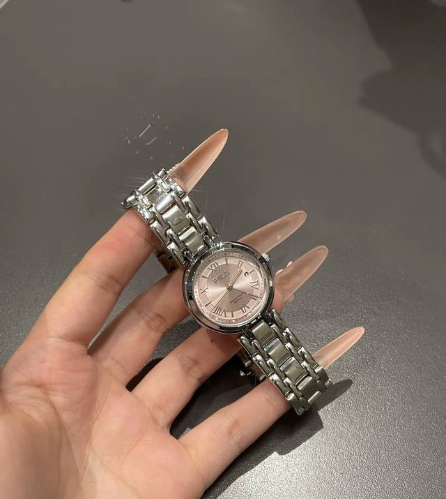 I absolutely adore this little silver Fila watch! The dial is a soft cherry blos