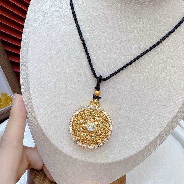 Double-sided diamond-encrusted compass with black rope, a dazzling display of s
