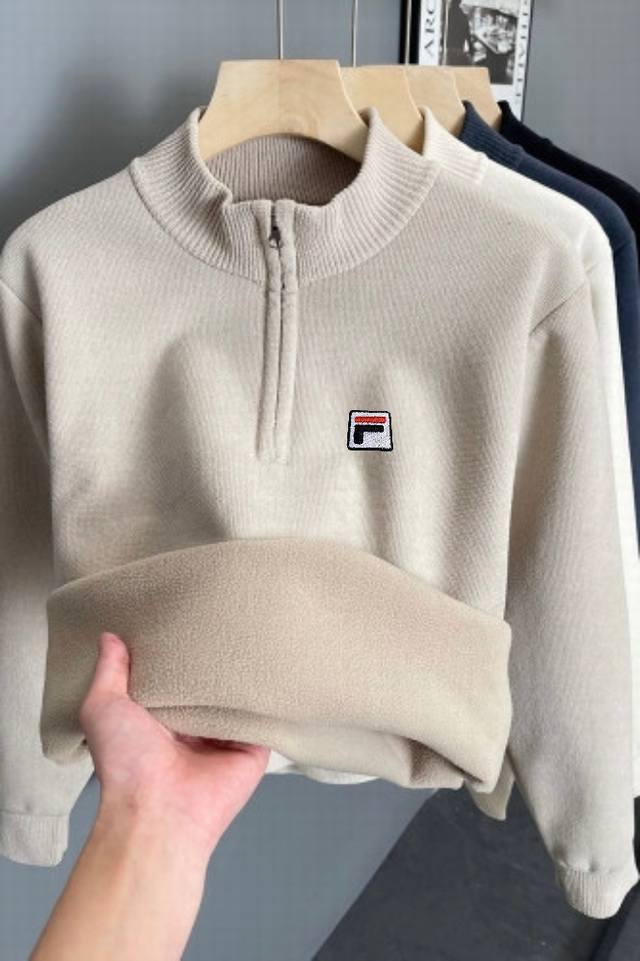 Fila's new season mock neck zip-up sweater, a classic reimagined with fine knit