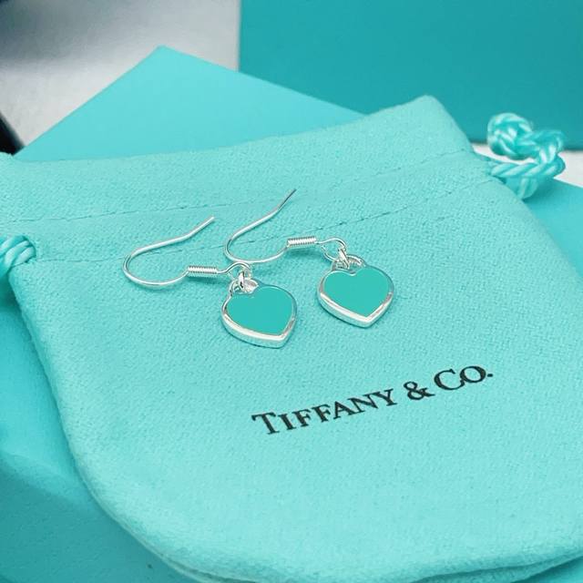 Tiffany's latest heart-shaped light blue earrings are made of the same brass mat