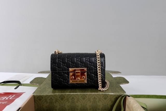 Large Quantity Price DDD Description: This Padlock small shoulder bag has a stru