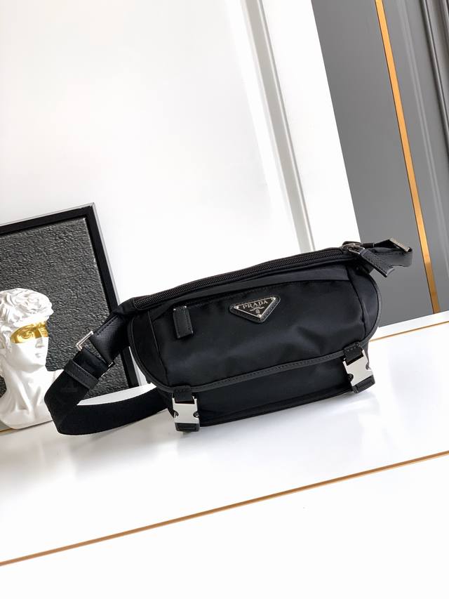 Mini Messenger Bag DDD This flap-over shoulder bag is crafted from signature Pra