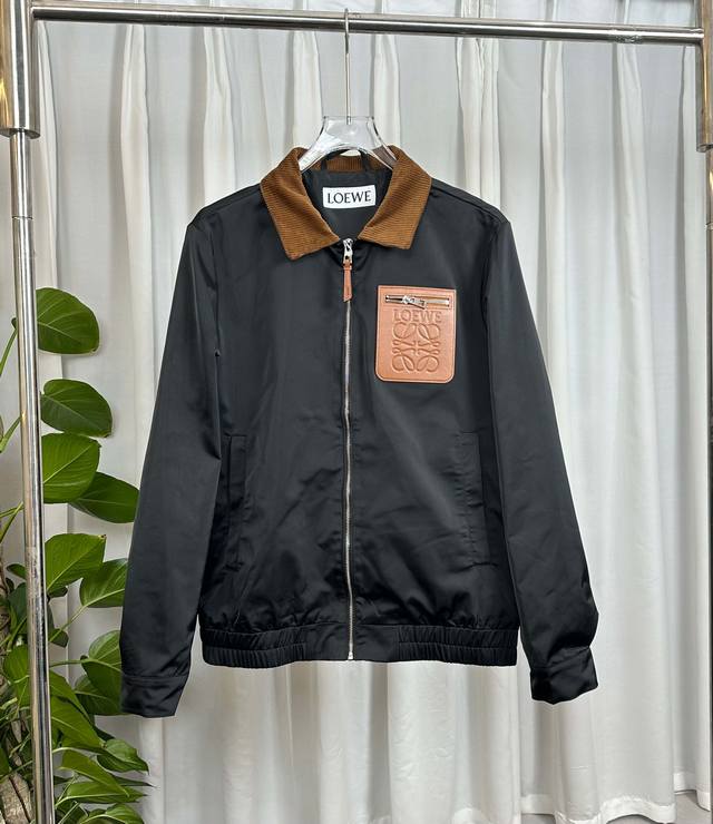 This review focuses on the Loewe 2026 Spring/Summer bomber jacket. It features a