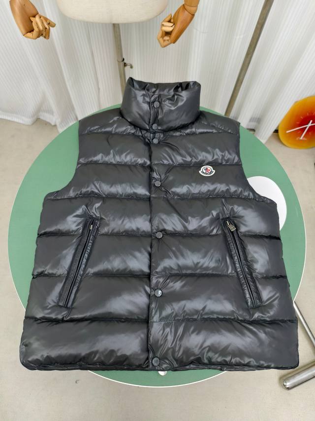 Style Number: Y163 The Moncler classic down Tib vest with a stand-up collar is i