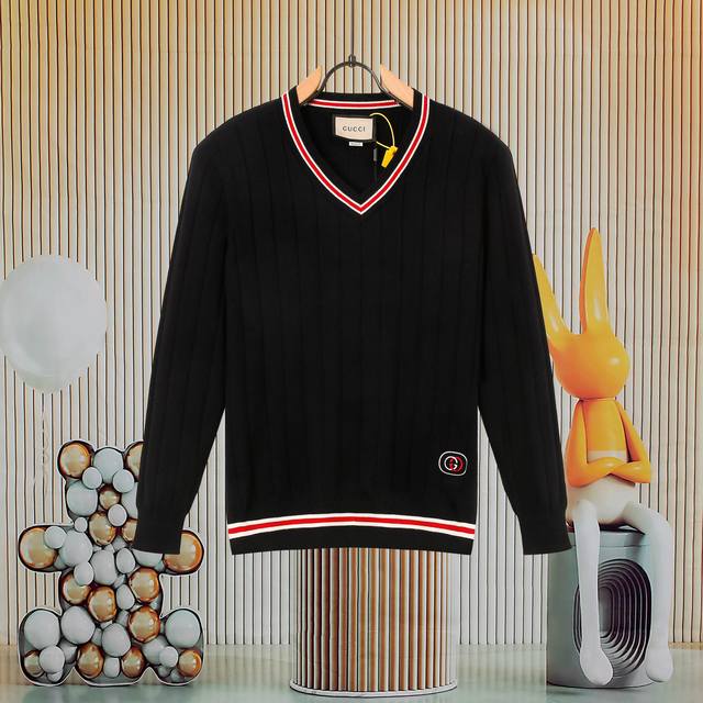 A popular Gucci ribbed gradient V-neck knit sweater. The logo on the front and h