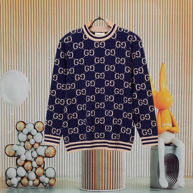 A popular Gucci all-over logo knit sweater with top-notch craftsmanship and exqu