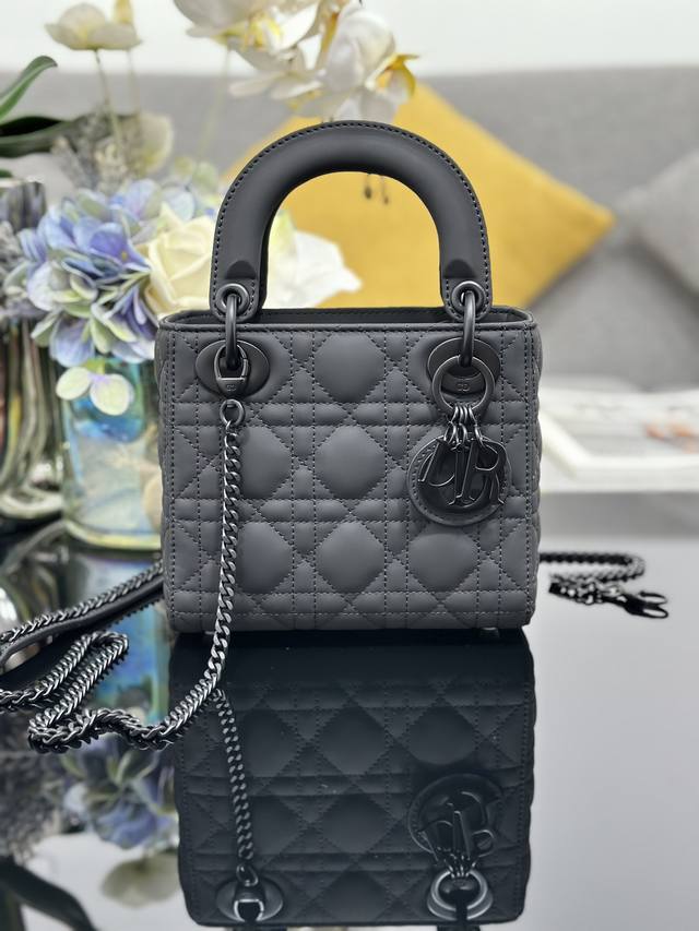 Lady Dior three-compartment suede cannage leather flap handbag with chain strap.
