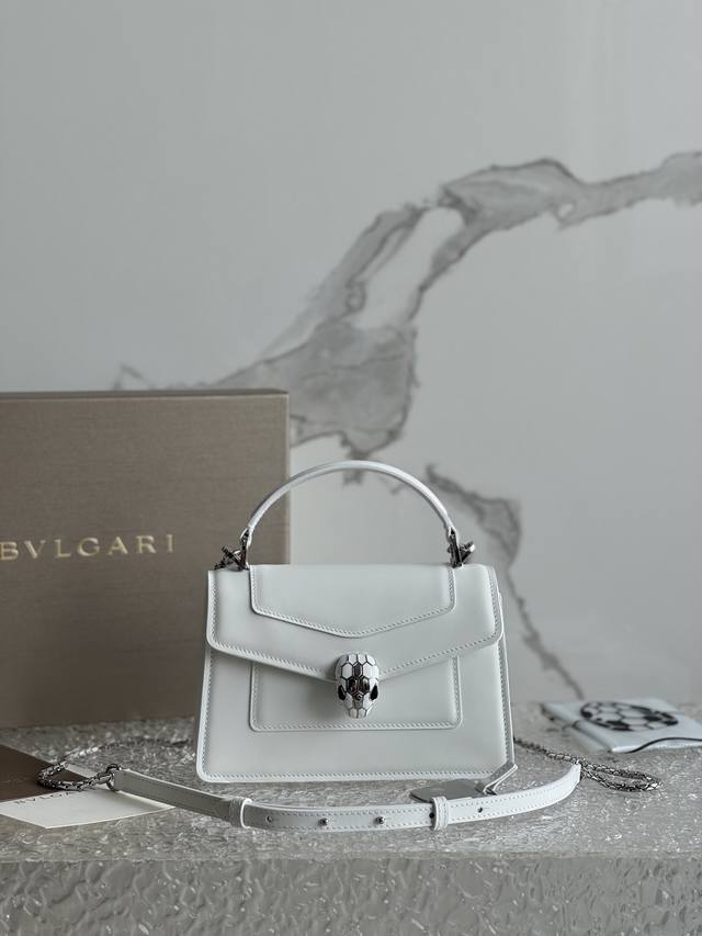 The Serpenti Forever mini handbag, crafted from calfskin, combines modern style
