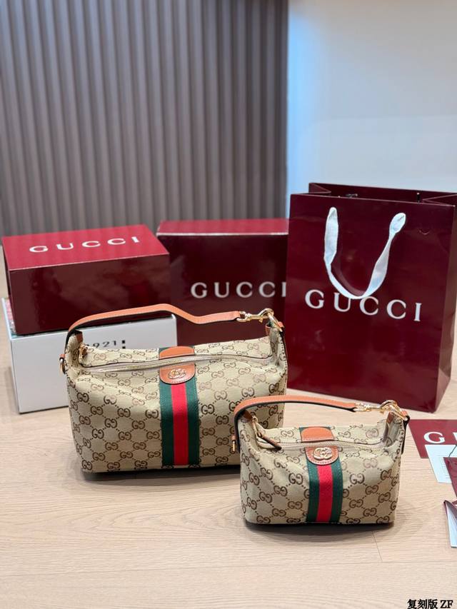 复刻版 Gucci Vanity饭盒包 Gucci Vanity饭盒包，经典Ophidia系列，采用Gg Supreme帆布+红绿织带，复古又时髦。圆角矩形设计