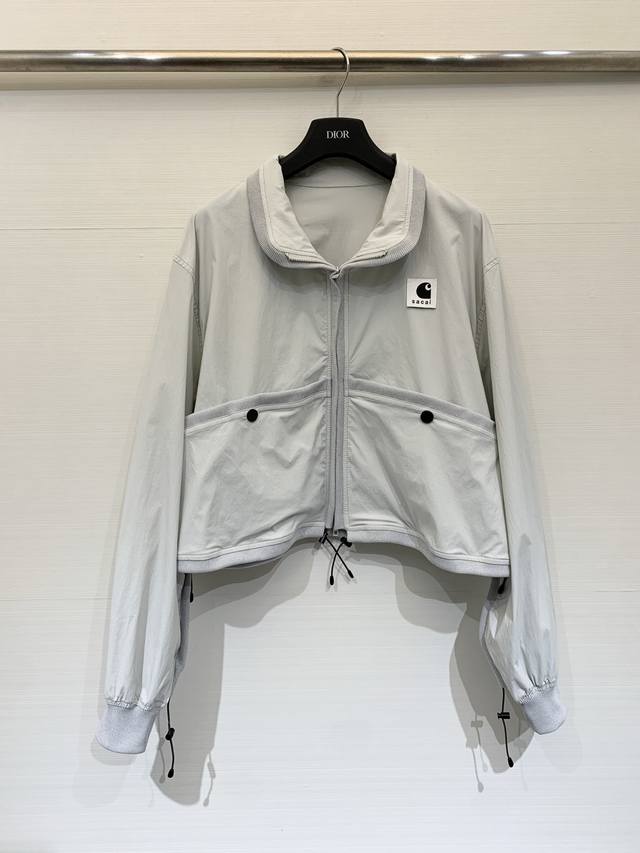Sacai Spring/ Summer 2026 Collaboration Short Color-Blocked Jacket. Olive green