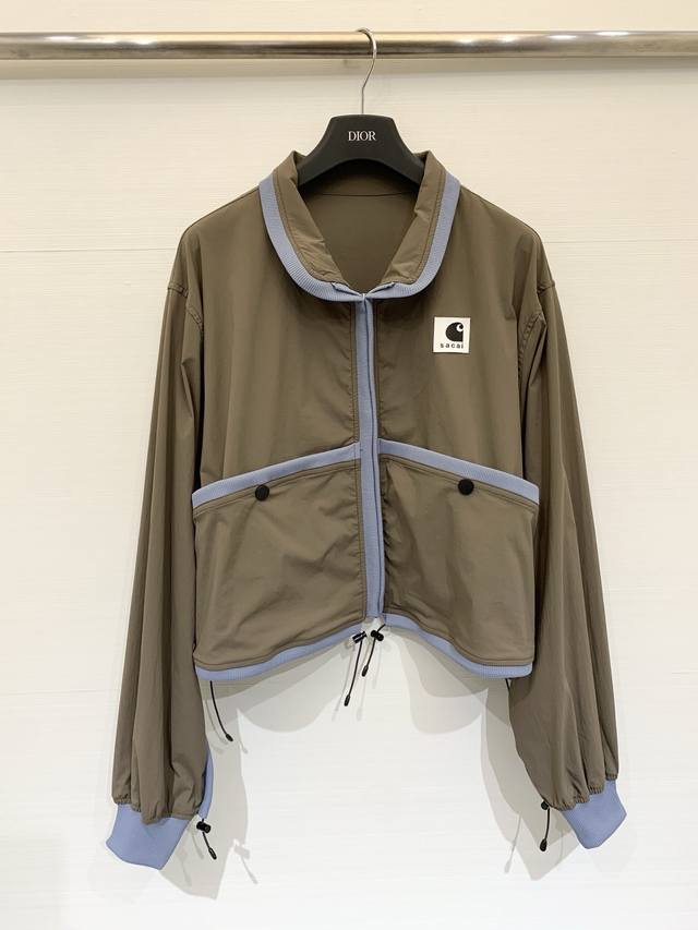 Sacai Spring/Summer 2026 Collaboration Short Color-Blocked Jacket. Olive green n