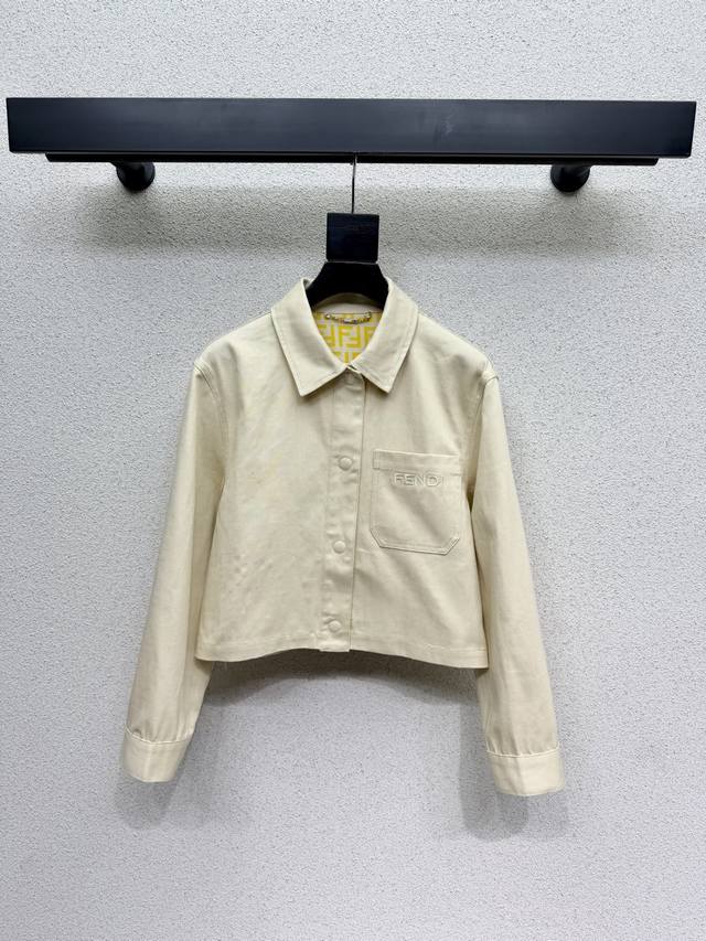 Fd's beige denim jacket features a washed, vintage-inspired fabric. The color is