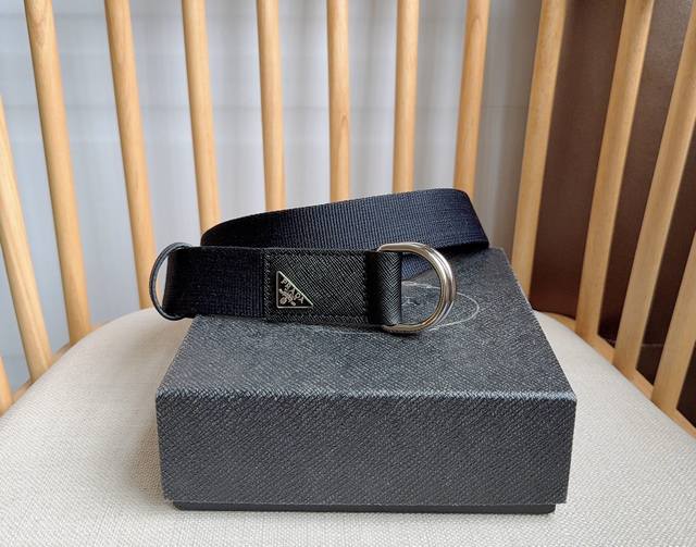 Prada's latest workwear-style cotton woven belt features a casual and practical