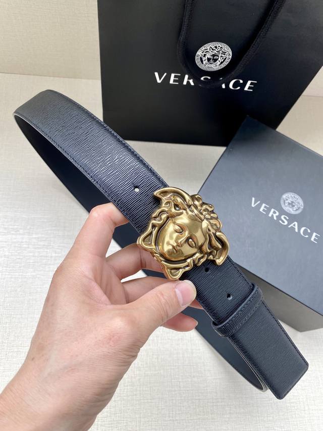 Versace, 3.8cm wide. This stylish belt is crafted from grained calfskin leather