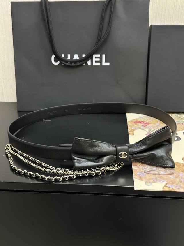 Chanel New Bow Belt This bow-embellished leather belt with a chain is incredibly Chanel New Bow Belt This bow-embellished leather belt with a chain is incredibly
