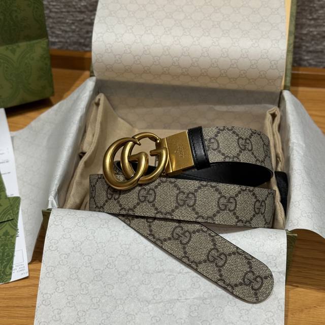 G-brand reversible belt This belt features a twist buckle and an embossed import