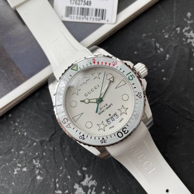 Gucci's new unisex dive watch, 40mm case diameter, features the brand's iconic "