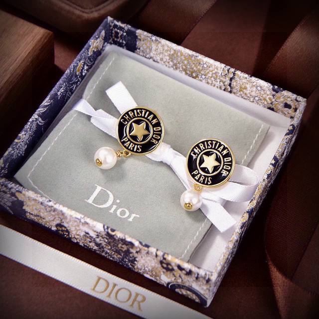 Dior's new gold letter Jadior stud earrings; consistent with boutique quality, m