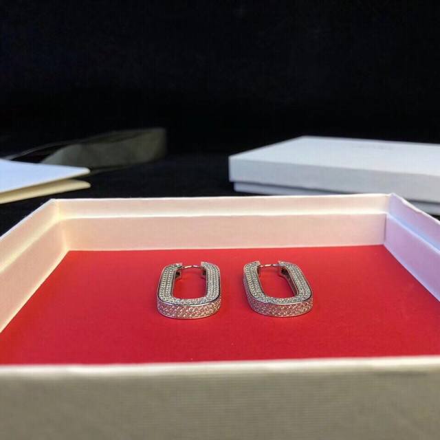 Celine's latest three-sided earrings, set with 600 Swarovski crystals, have beco