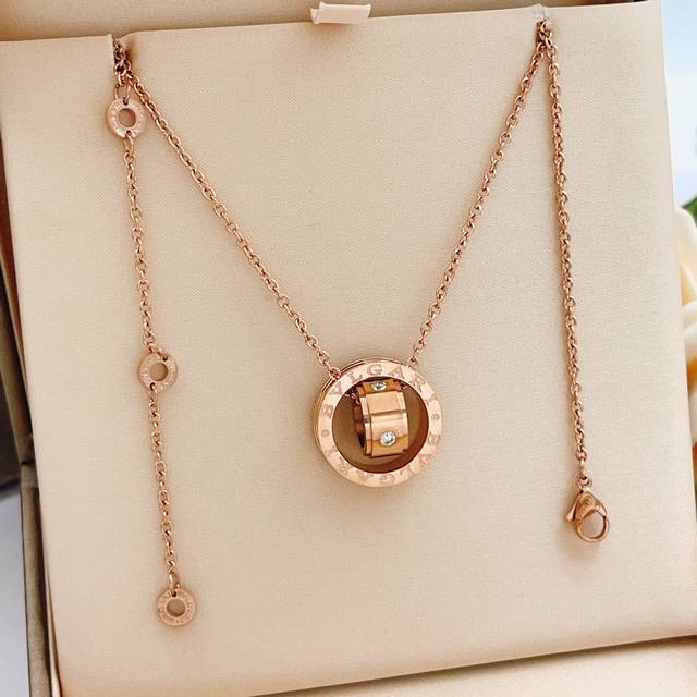 This is the latest rose gold ring-and-cylinder necklace from Bvlgari, made of th