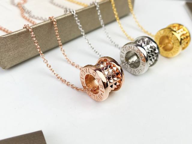 The Bvlgari Little Red Man Studded Necklace reinterprets Bvlgari's most famous c
