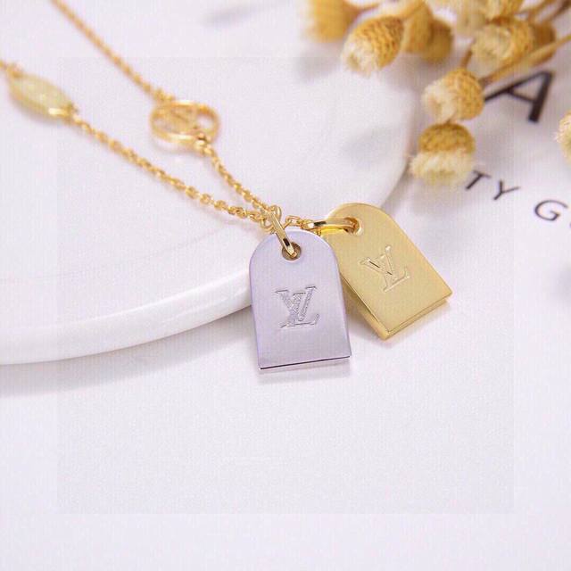 Absolutely stunning! This Louis Vuitton double-tag bracelet is a high-end custom