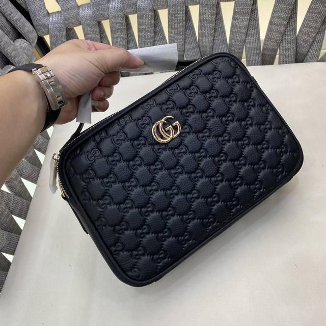 Gg printed embossed messenger bag, a classic travel accessory reimagined in a ne
