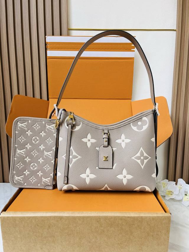 M47180 Grey Silk Steel Carryall Small Handbag. Crafted from Monogram Empreinte l
