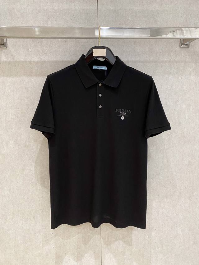 This Prada Spring Summer 2026 design features a classic polo collar with a simpl