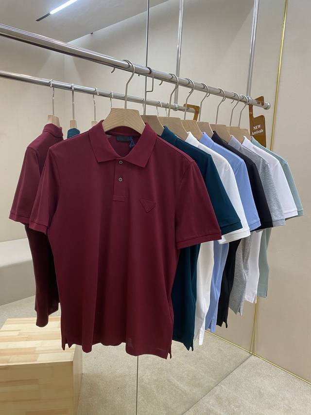 This is a featured item: a Prade cotton polo shirt with an 8-color triangular lo