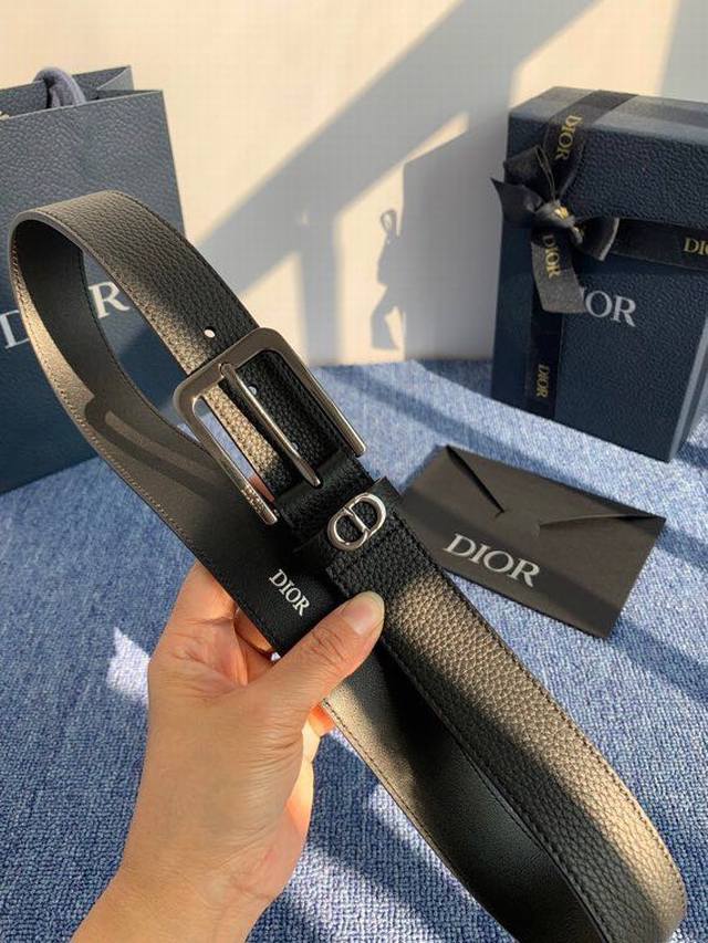 55095 is meticulously crafted from black grained calfskin leather, adorned with