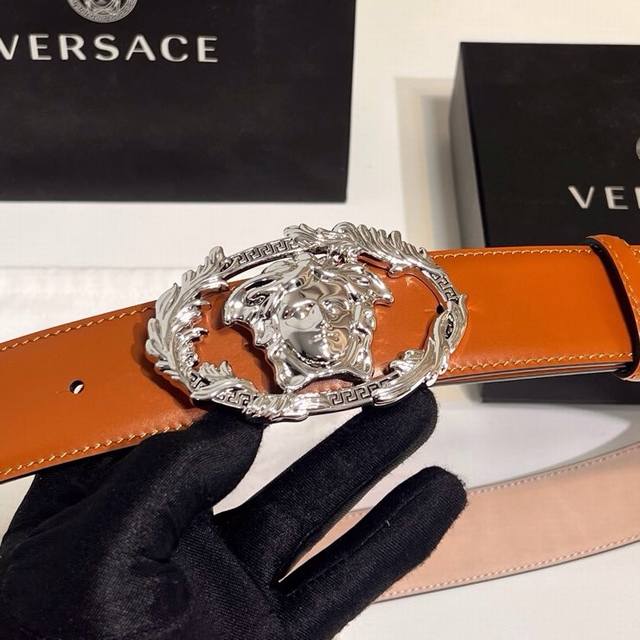 Versace's new calfskin leather belt, adorned with buckle Crest accessories. The