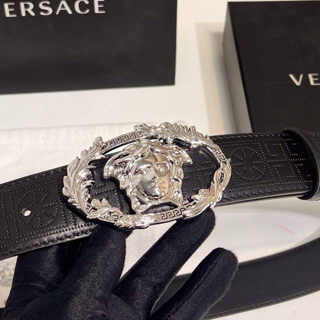 Versace's new calfskin leather belt, adorned with buckle Crest accessories. The