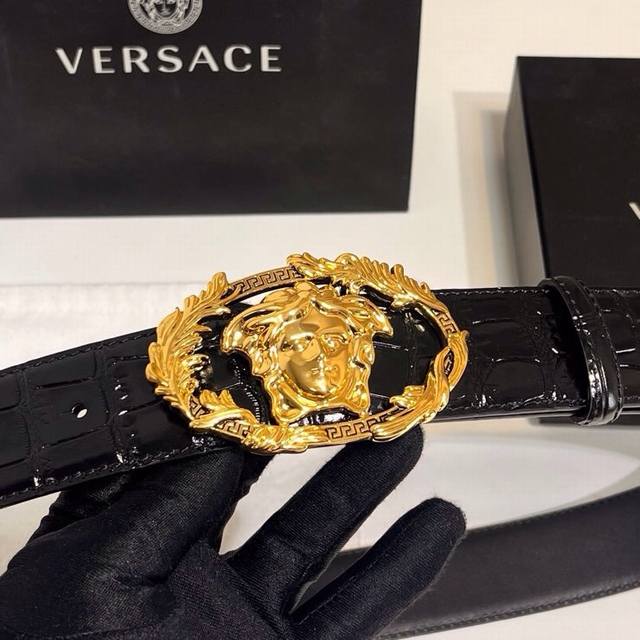 Versace's new calfskin leather belt, adorned with buckle Crest accessories. The